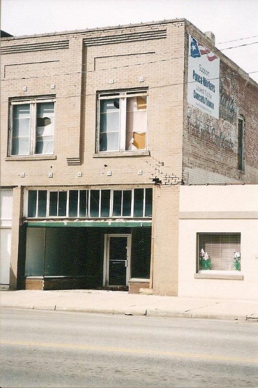Boarded-up storefront, downtown Ponca City